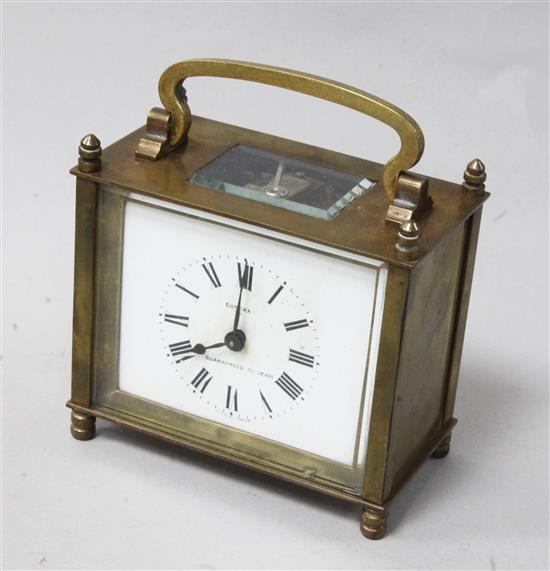 A Eureka gilt brass carriage clock, with white enamelled dial, in outer wooden carrying case